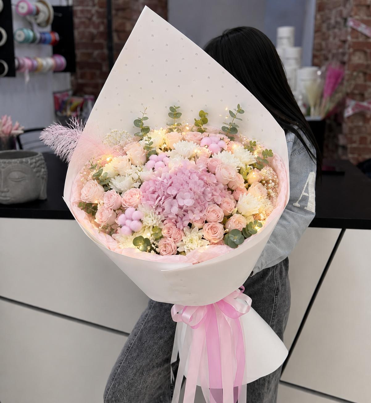 An arrangement in soft pink tones